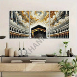 Three-panel wall art of a religious building with gold and black details, displayed above a wooden cabinet.