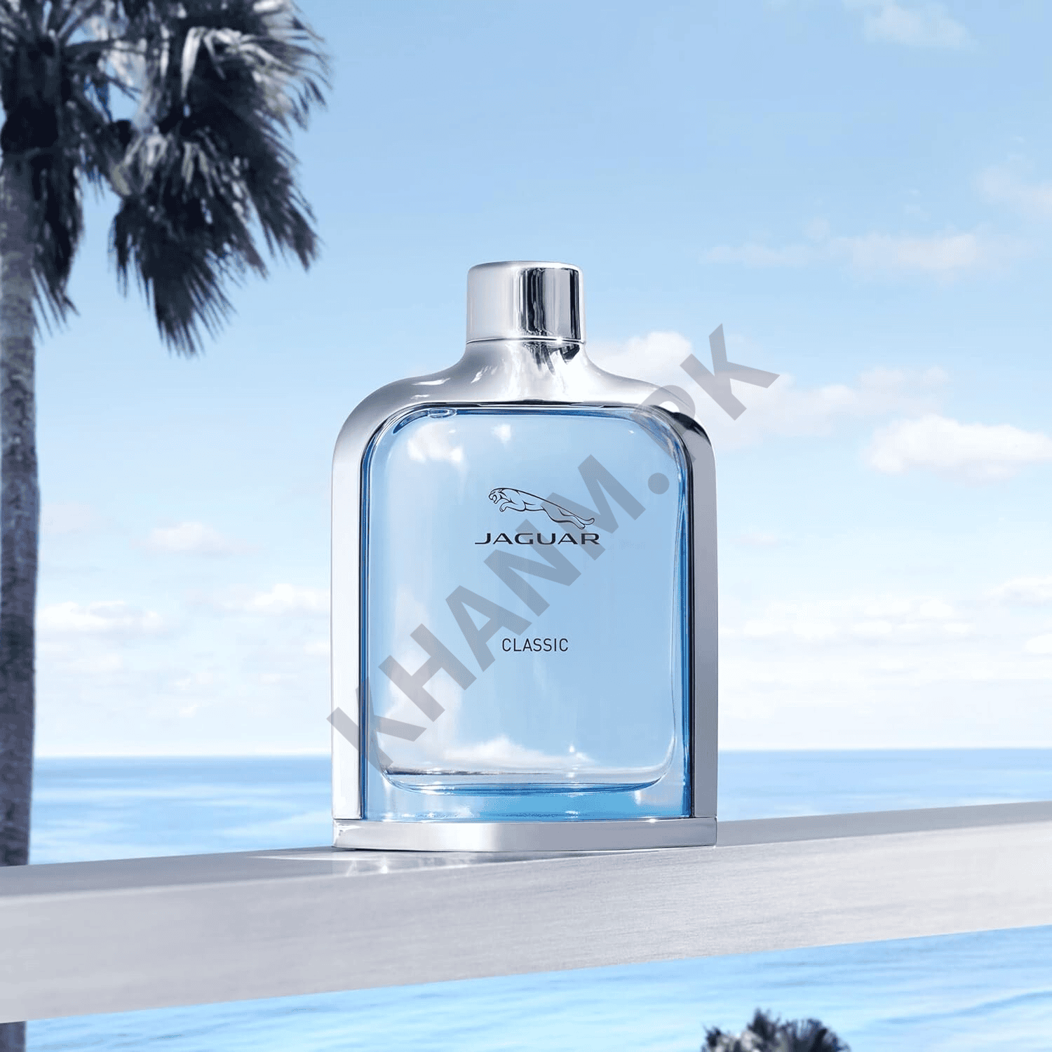 Jaguar Classic perfume bottle with a scenic background of palm trees and ocean.