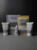 The Ordinary skincare products including face and hand cream, serum, and packaging on a dark background