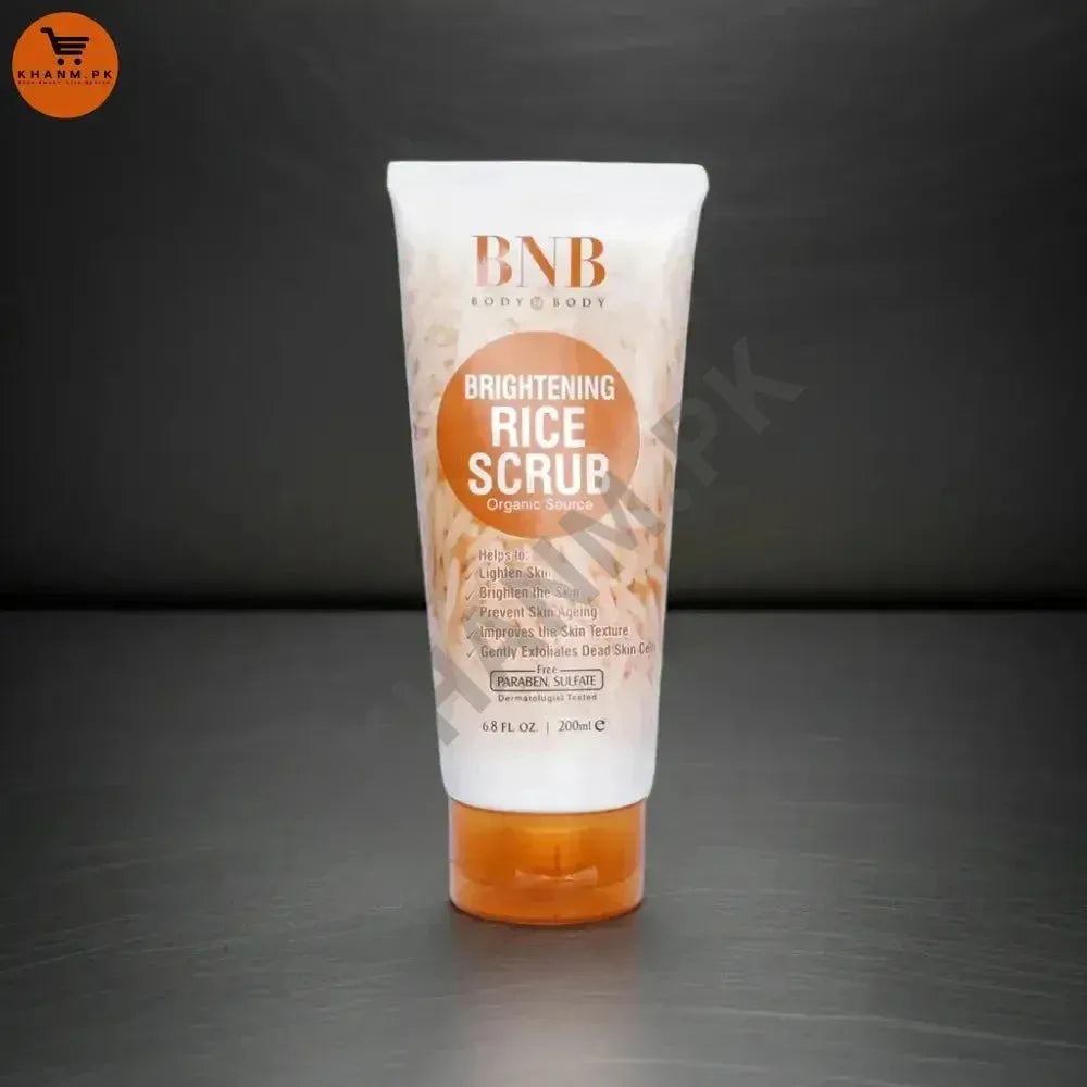 Tube of BNB Brightening Rice Scrub on a dark background